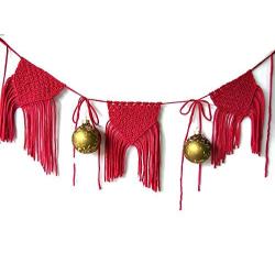 Macrame wall hanger. Red Christmas banner.