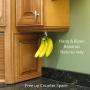 Banana Hook Hanger Under Cabinet Hook Ripens Bananas with Less Bruises, Hang Other Lightweight Kitchen Items, Folds Up Out of Sight When Not in Use, Self-Adhesive + Pre-drilled Screw Holes WHITE Banana Hook Hanger Under Cabinet Hook Ripens Bananas with Less Bruises, Hang Other Lightweight Kitchen Items, Folds Up Out of Sight When Not in Use, Self-Adhesive + Pre-drilled Screw Holes WHITE