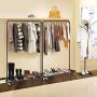 Simple Trending Clothes Garment Rack, Clothing Rolling Rack with Mesh Storage Shelf on Wheels, Bronze